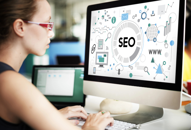 Woman working on SEO and Marketing at computer Woman working on SEO and Marketing at computer